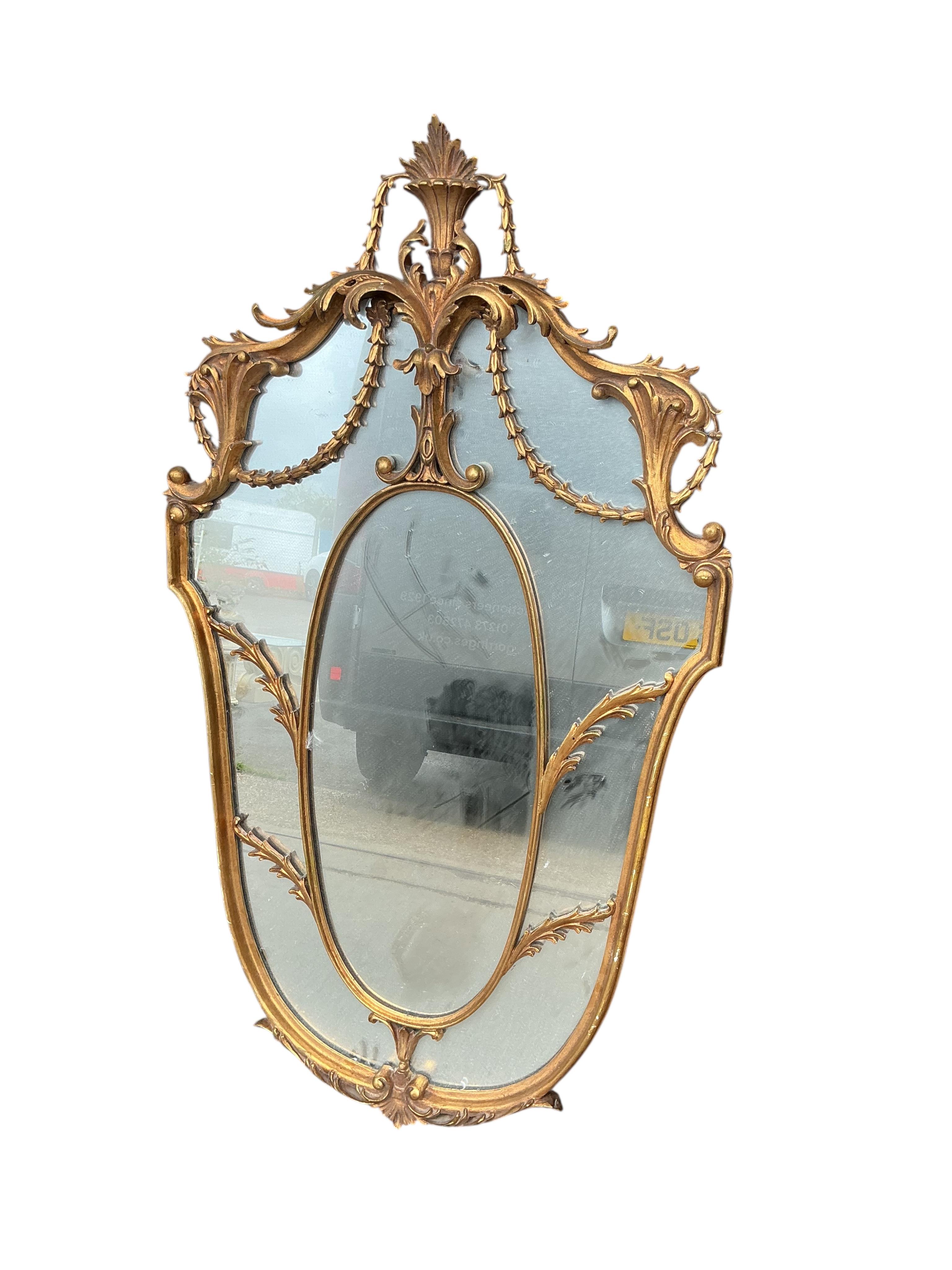 A decorative 18th century style Italian gilt composition wall mirror, width 70cm, height 126cm